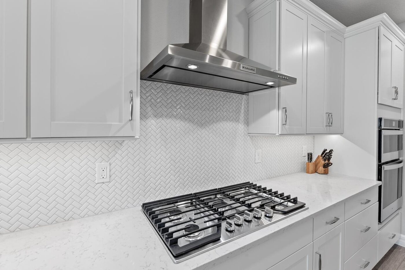 129 Cattail Bay Drive — the gas cooktop under its hood