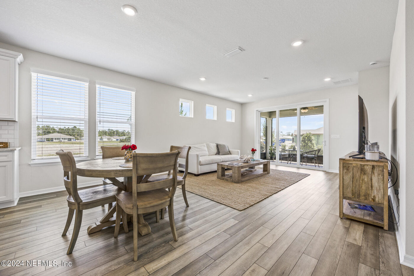 186 Curved Bay Trail &mdash; the dining room, out to the lanai