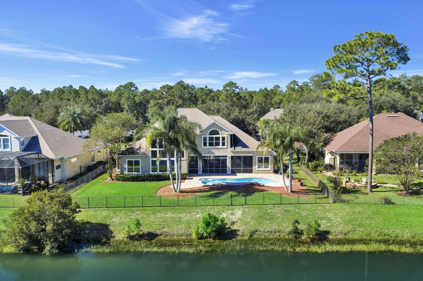 237 S Hampton Club Way — the house across the lake, from the air
