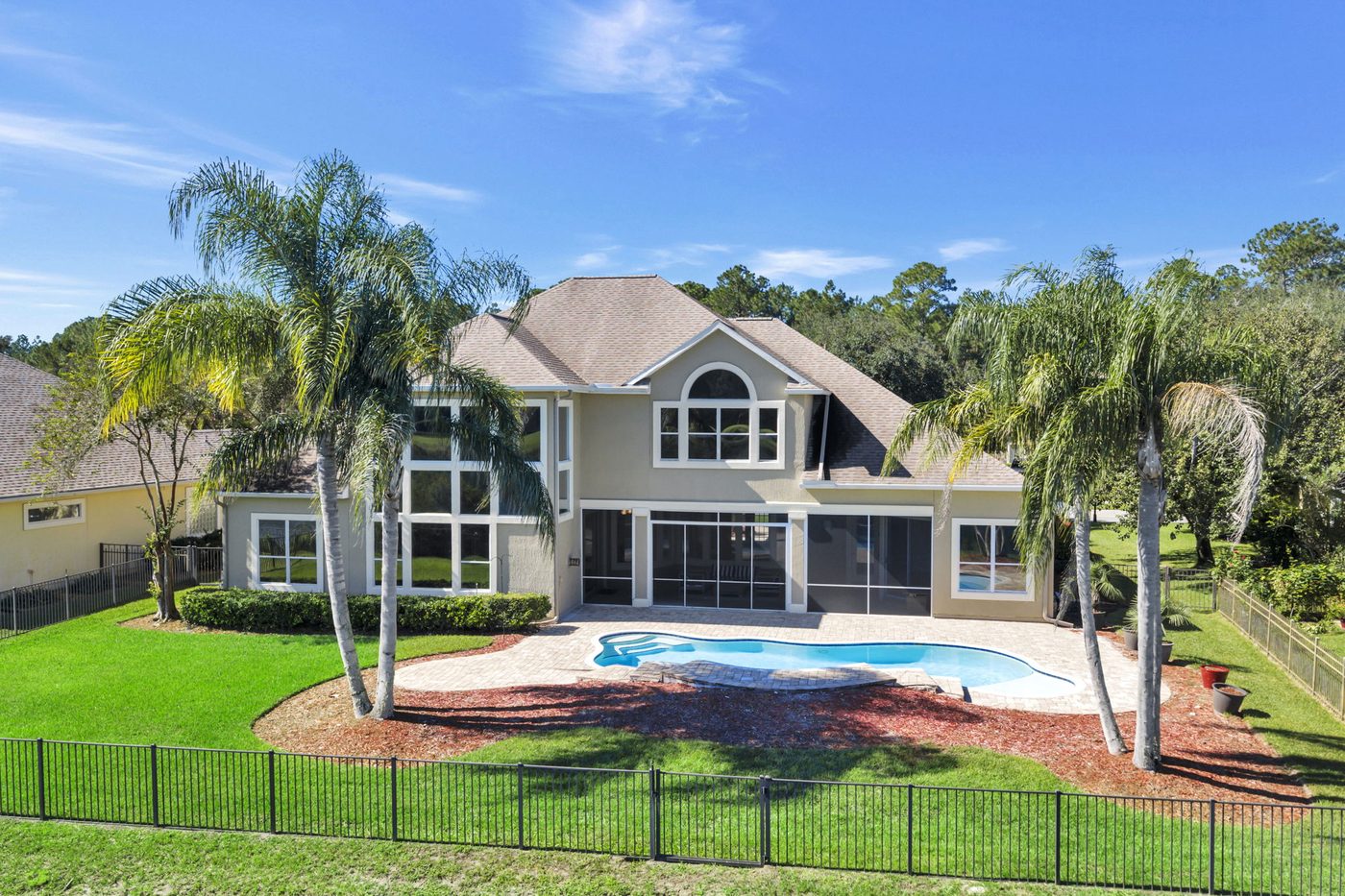 237 S Hampton Club Way — the rear of the house, the pool and the fenced yard from above