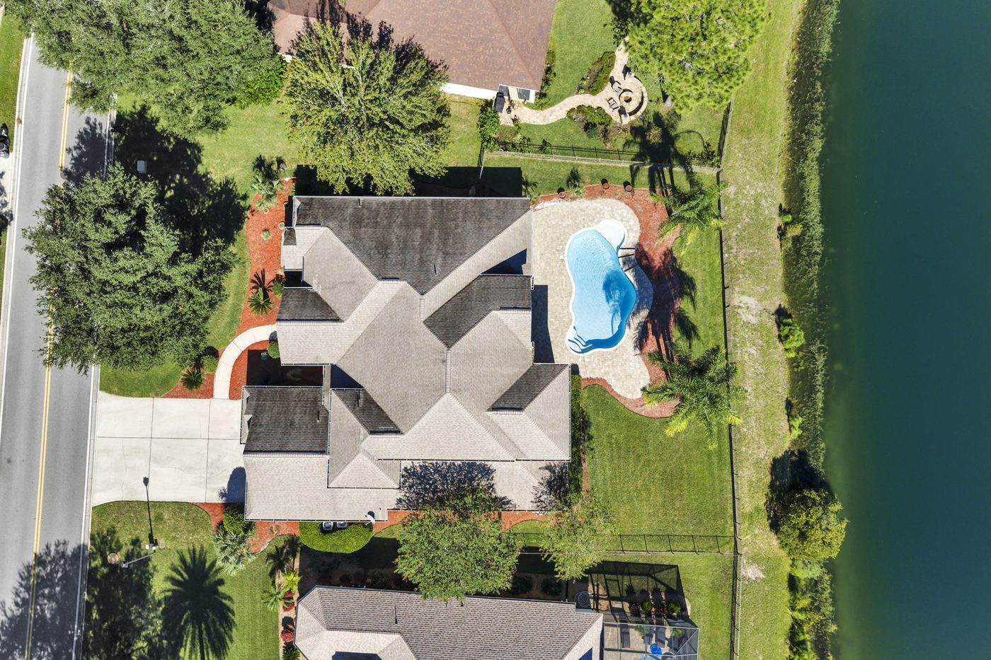 237 S Hampton Club Way — the 0.9-acre lot and the lake from overhead