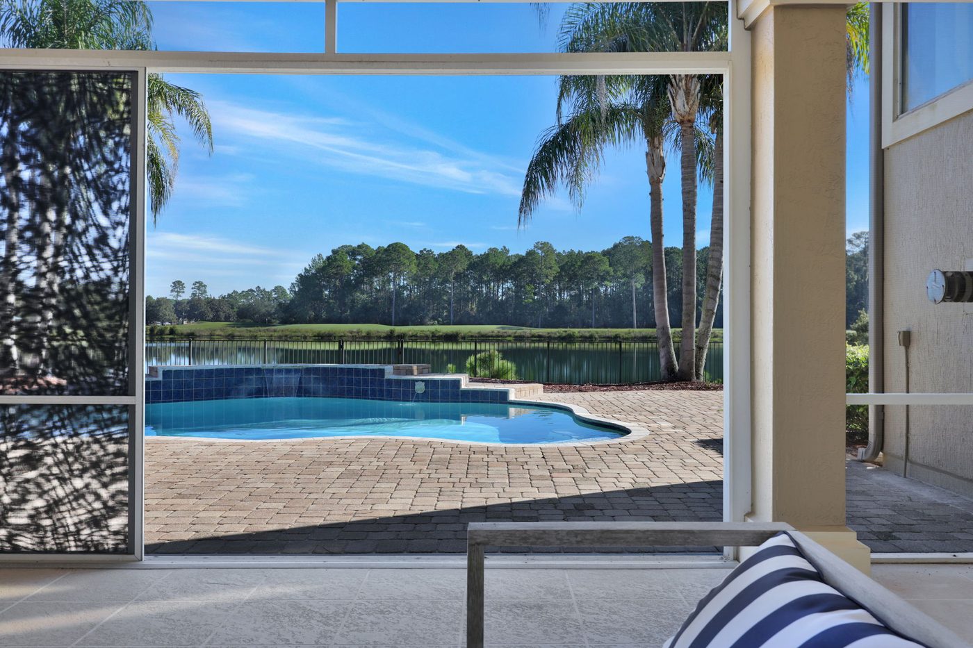 237 S Hampton Club Way — the screened porch and the pool