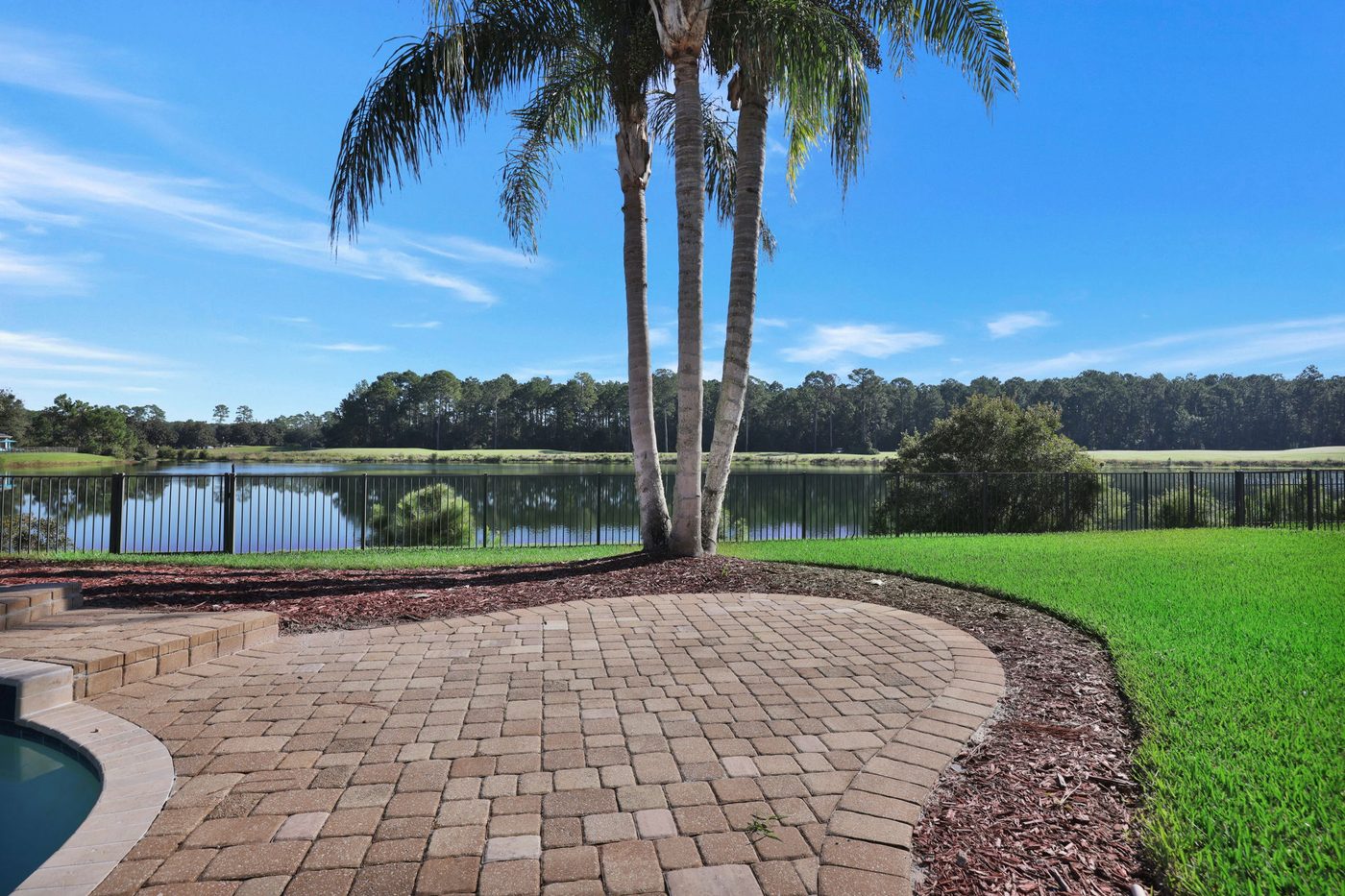 237 S Hampton Club Way — the paver patio and the lake