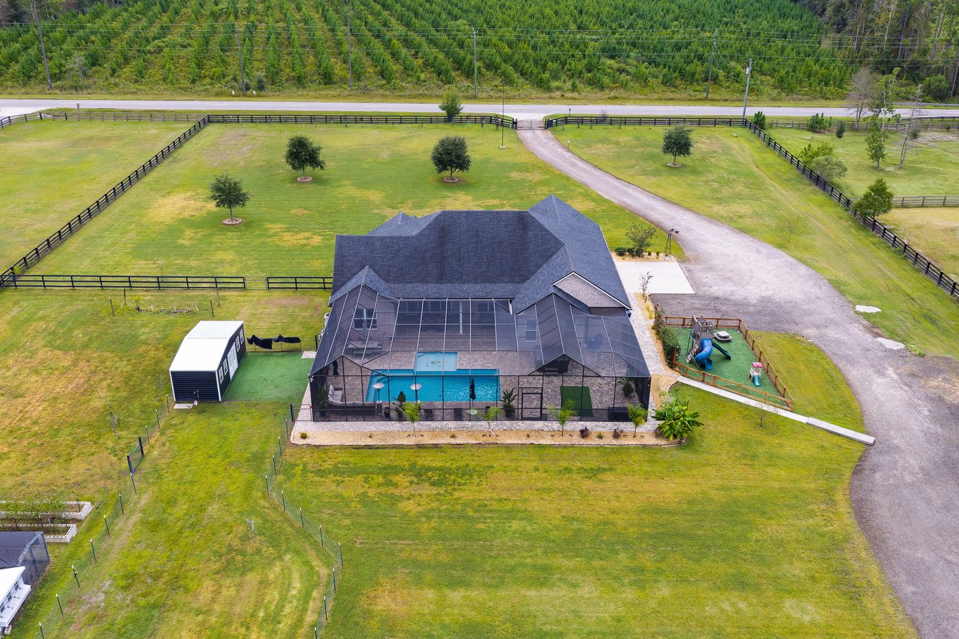 56057 Griffin Road &mdash; the pool and the rear pasture from above