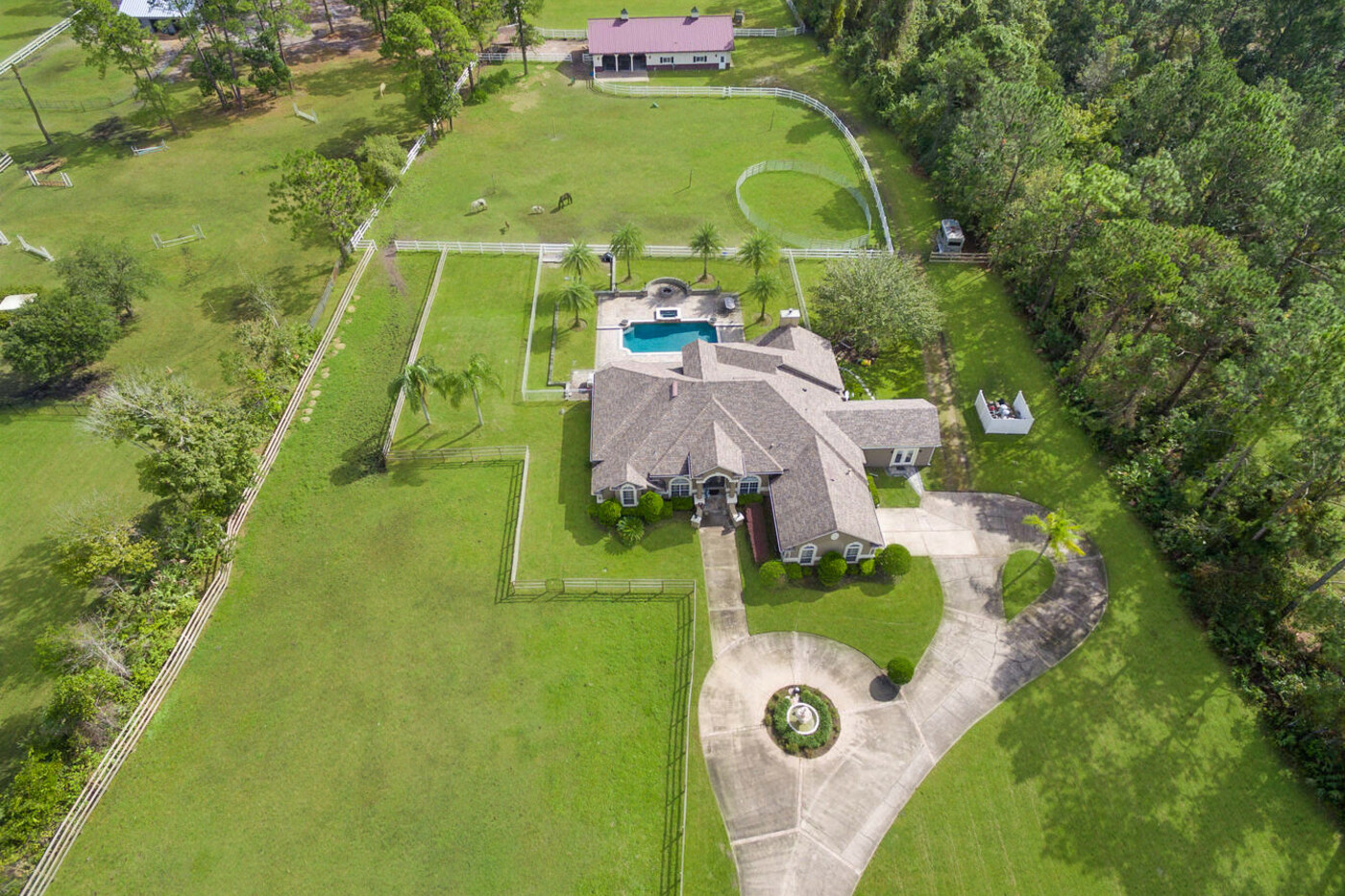 10680 Quail Ridge Drive — from the air — the house, the pool and the barn