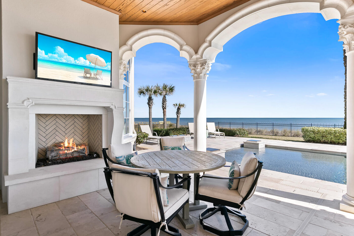 801 Ponte Vedra Boulevard &mdash; the arcade, fireplace and dining, ocean beyond